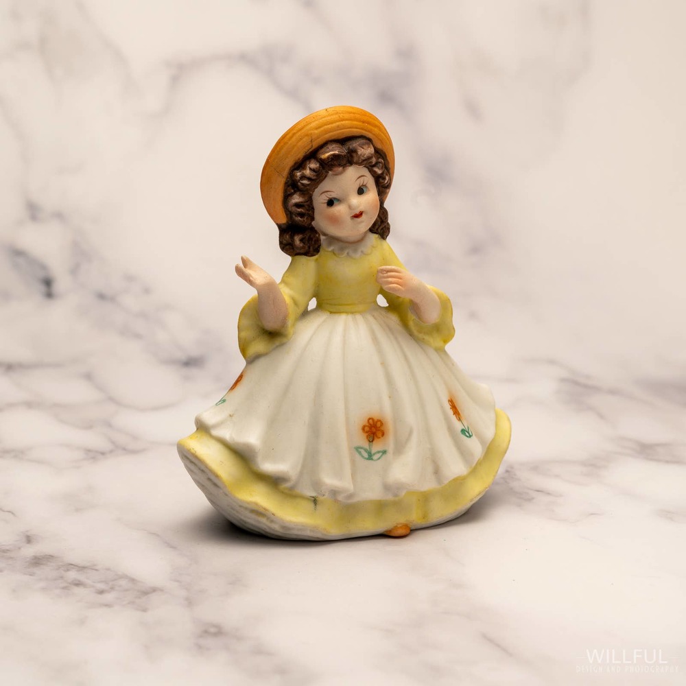 Vintage 1980s UCGC Yellow dressed girl in hat